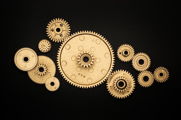 collection of gears illustrating example of triggers in marketing
